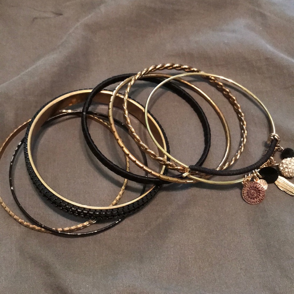 Black and gold bracelet with charms